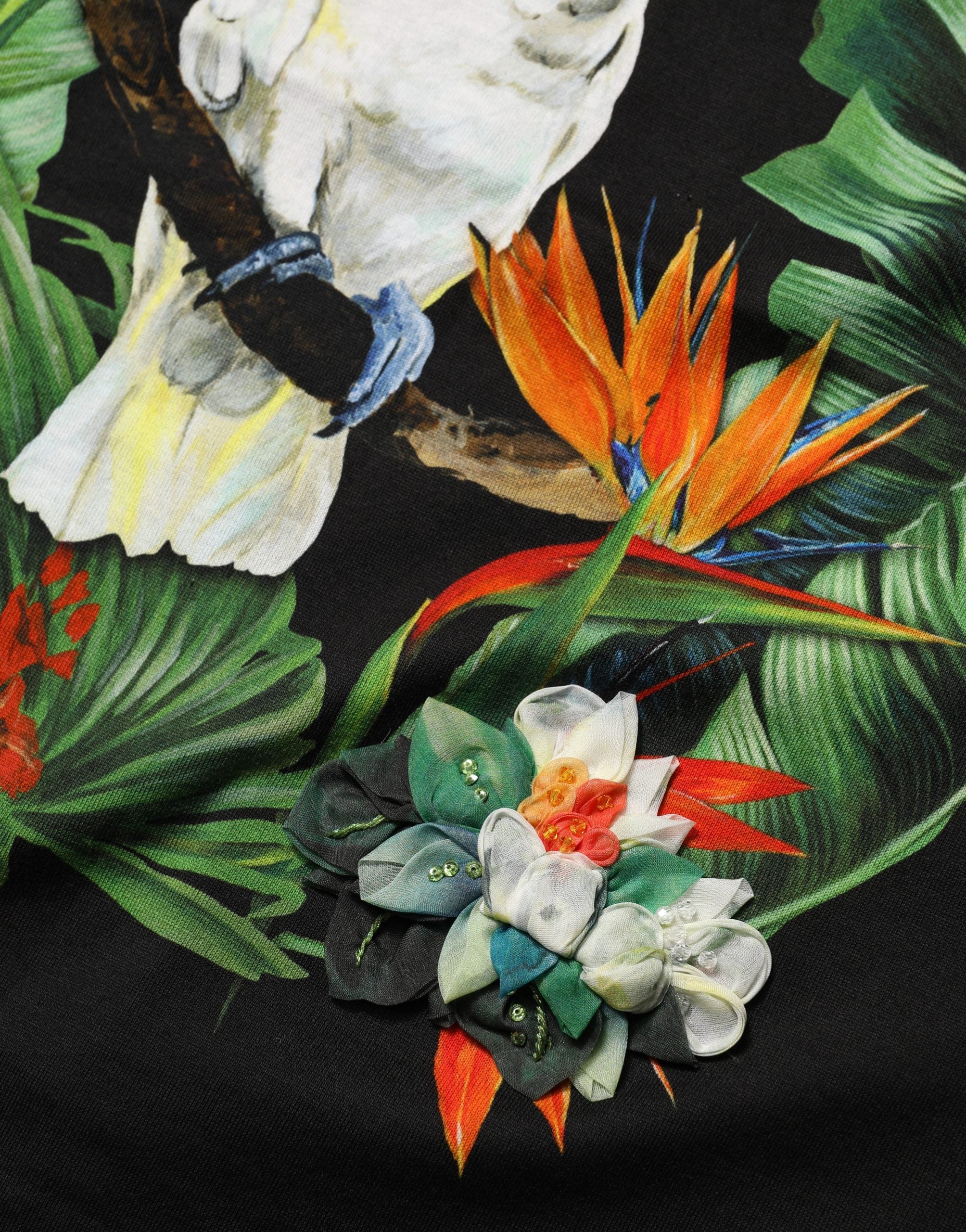 Dolce & Gabbana Schwarzes Baumwoll-T-Shirt mit tropischem Print und Rundhalsausschnitt