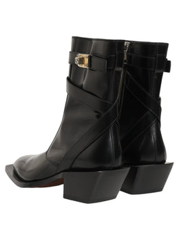 Dolce & Gabbana Schwarze Lederstiefel mit DG-Plakette, mittelhoher Schaft