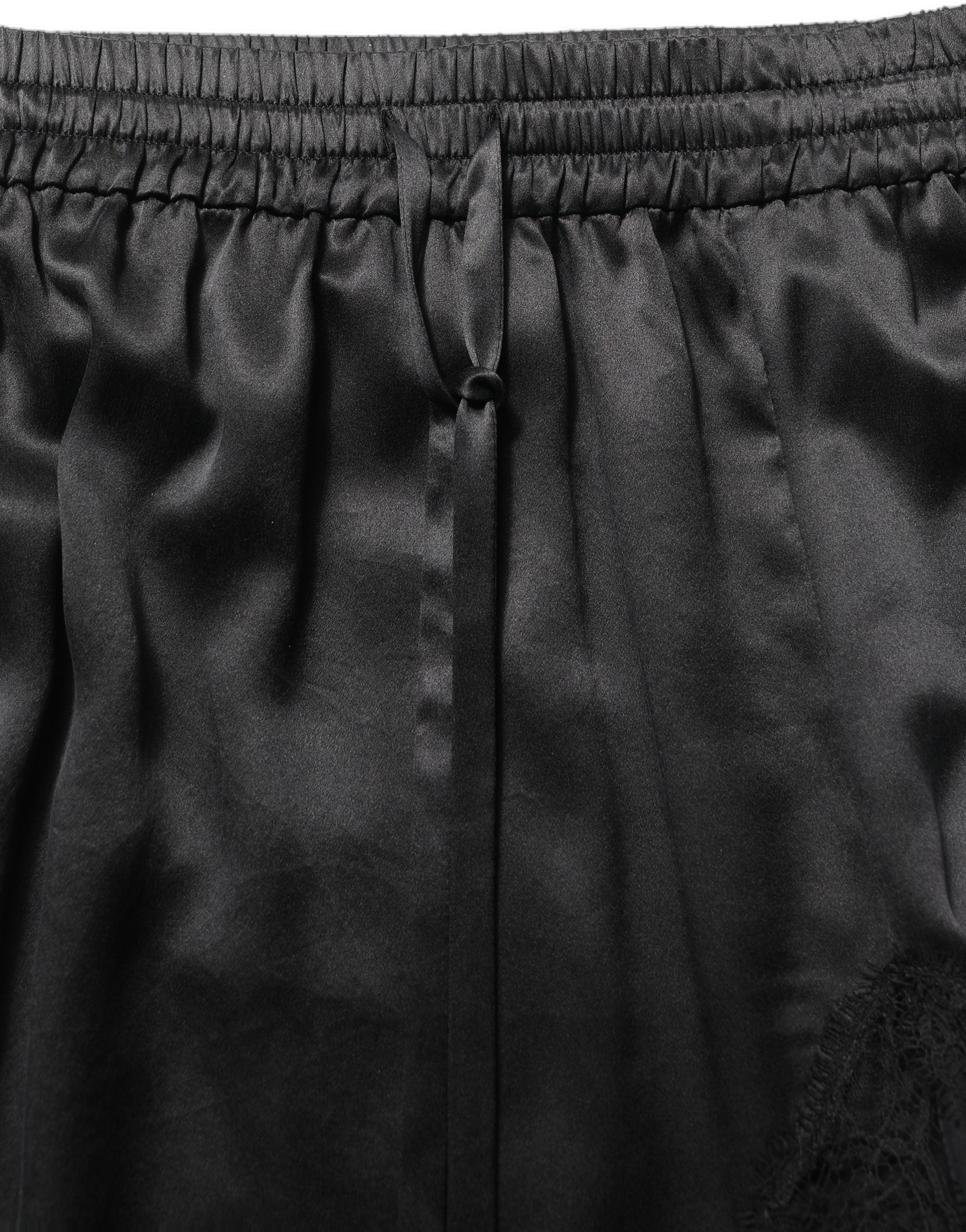 Dolce & Gabbana Schwarzer Satinrock mit Spitzendetails und seitlichem Schlitz