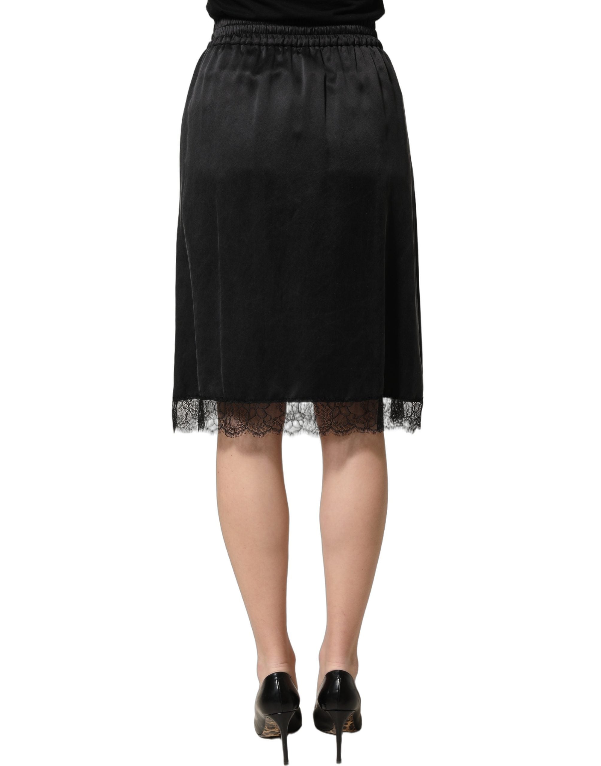 Dolce & Gabbana Schwarzer Satinrock mit Spitzendetails und seitlichem Schlitz