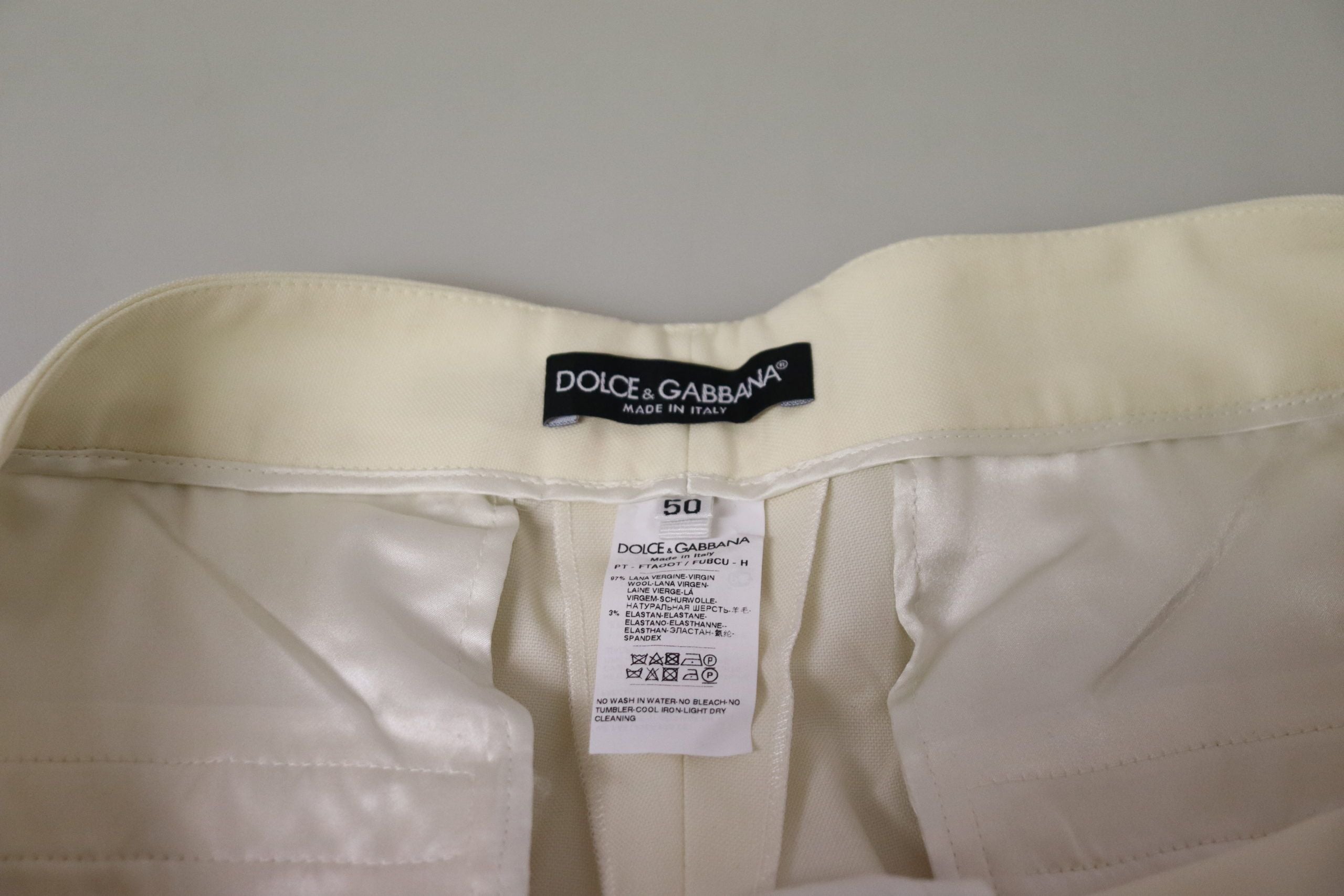 Dolce & Gabbana Elfenbeinfarbene Hose mit hoher Taille und umgeschlagenem Saum